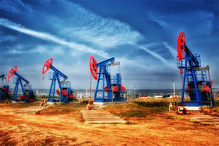 Oil rigs against a blue sky